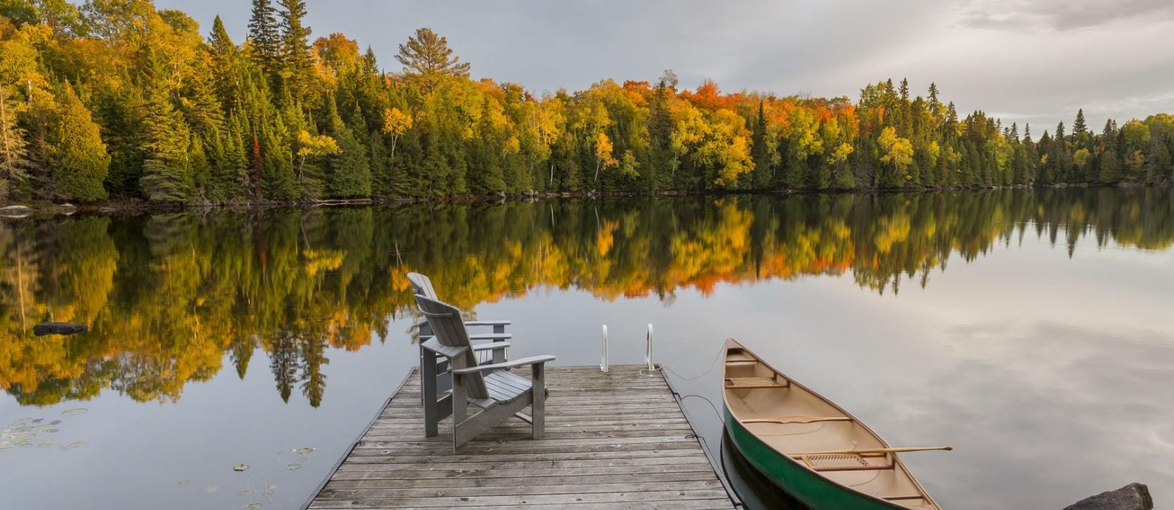 Chairs on a dock on a lake in Haliburton County